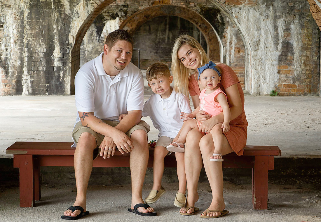close up of family at fort pickens arches