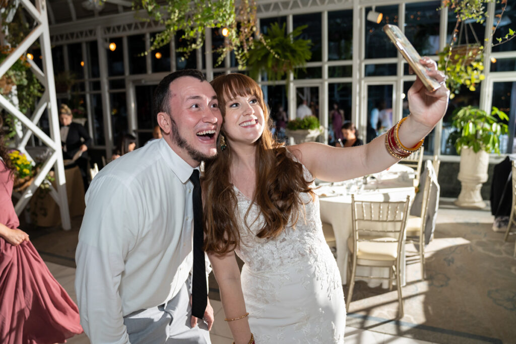 bride selfie with groomsman