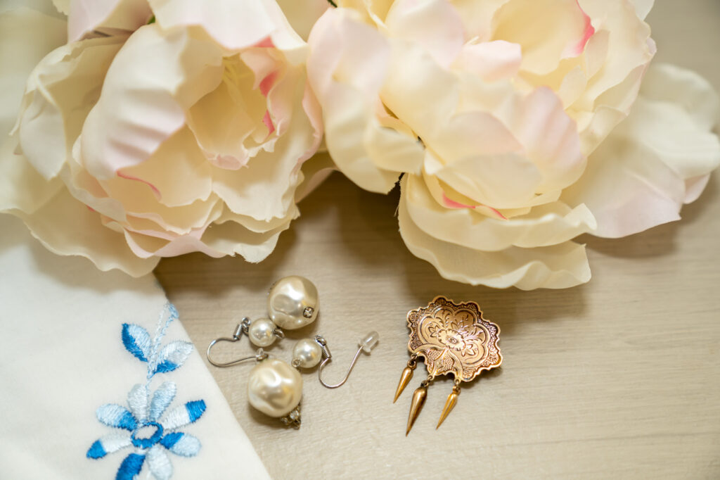 wedding details with flowers and hankie