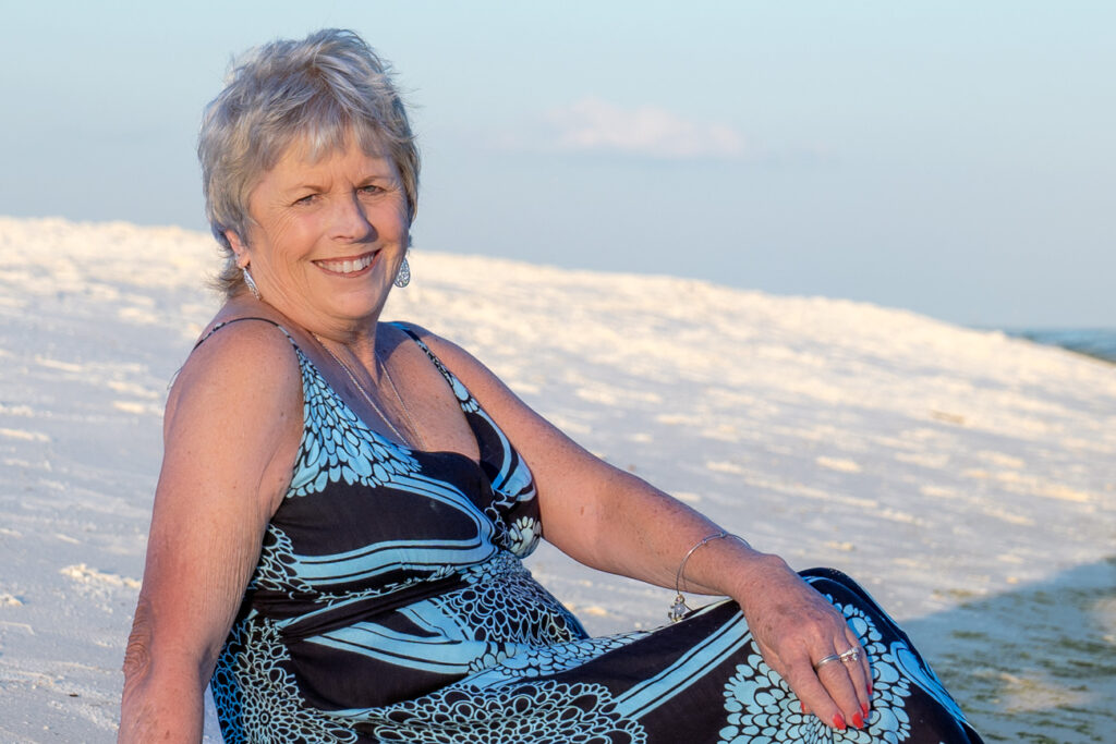 portrait of lady sitting on beach