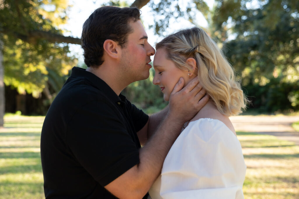 man kissing fiance on forehead