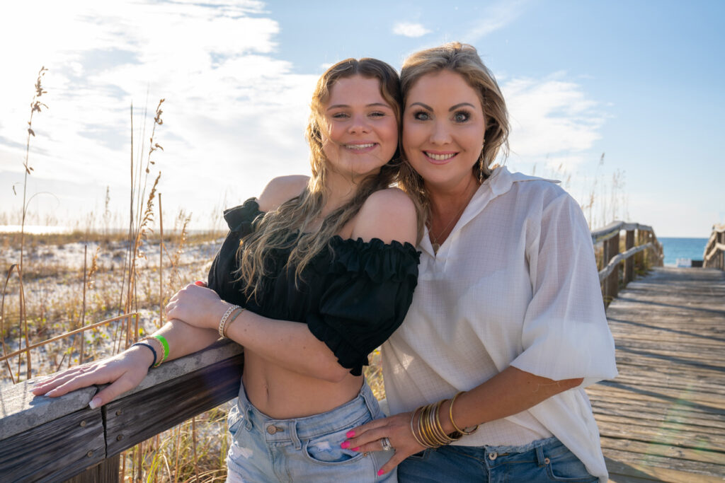 mother and daughter on pensacola beach boardwalk