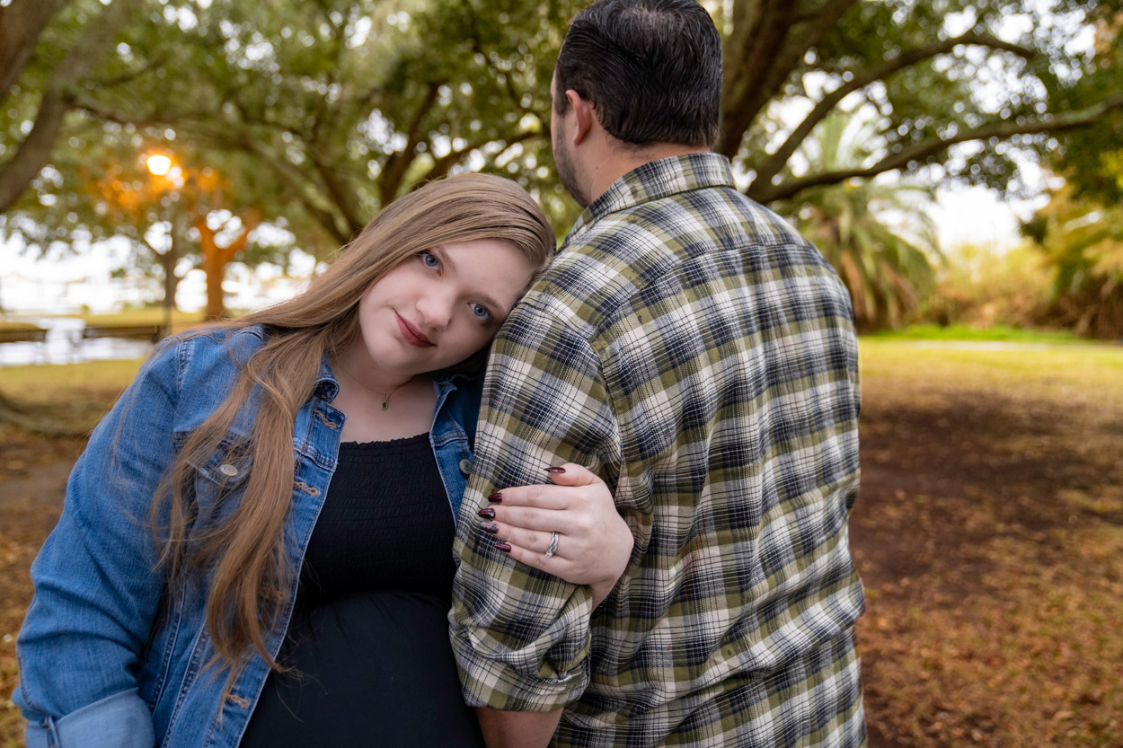 pregnant woman embracing husband