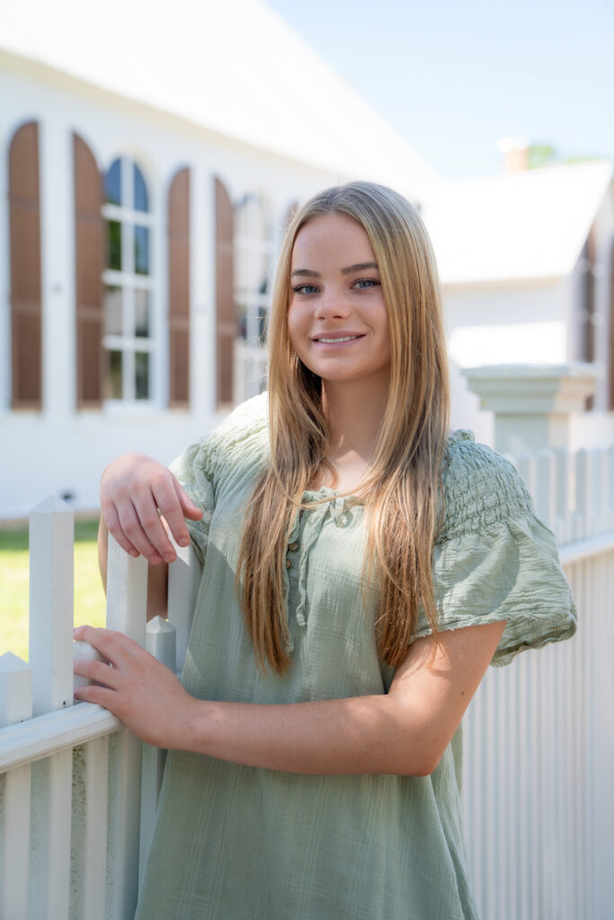 senior portrait of girl in from of downtown pensacola church